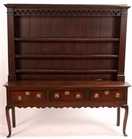 Lot 1014 - An oak and mahogany banded dresser