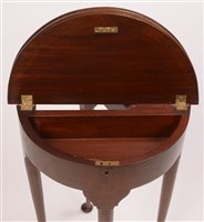 Lot 1018 - A demi lune occasional table.