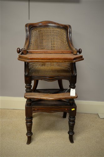 Lot 882 - A Victorian mahogany children's high chair with cane panelled back.