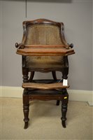 Lot 682 - A Victorian mahogany children's high chair with cane panelled back.