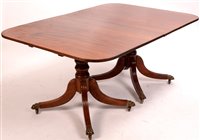 Lot 699 - A twin pedestal D-end dining table.