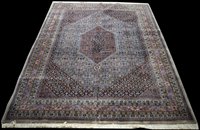 Lot 909 - A Tabriz carpet, the lozenge shaped fields...