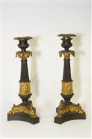 Lot 454 - A pair of bronze candlesticks