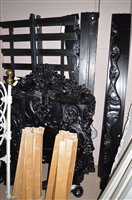 Lot 632 - A pair of black painted wooden single bed frames.