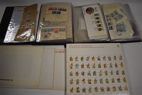 Lot 48 - Two albums of Swaziland stamps and an album of American commemorative stamps.