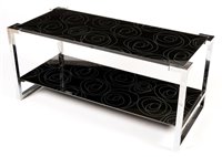 Lot 1064 - A vintage chromed metal and patterned black glass two tier coffee table