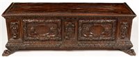 Lot 711 - An Italian carved walnut cassone.