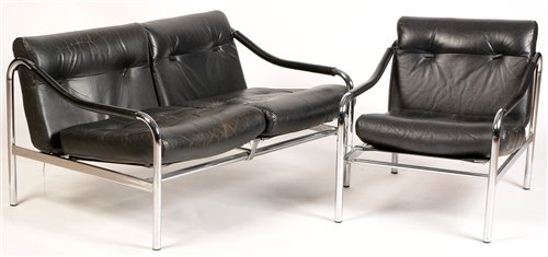Lot 1115 - Tim Bates for Pieff: a black leather two-seater sofa and matching armchair.