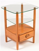 Lot 1128 - Ercol: a Windsor elm and glass two-tier occasional table.