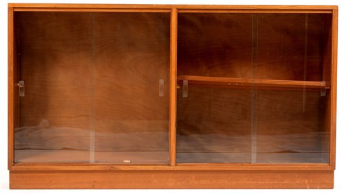 Lot 1085 - Manner of Gordon Russell: a mid 20th Century walnut glazed bookcase.