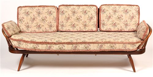 1089 - Ercol: a stained beech and elm studio couch.