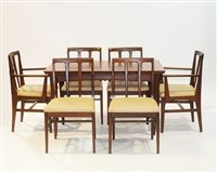Lot 1147 - A.Younger teak draw-leaf dining table and six chairs, the table 75cms high.
