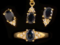 Lot 577 - Sapphire and diamond ring, earrings and pendant