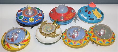 Lot 1092 - Plastic and tin plate flying saucers