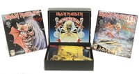 Lot 392 - Box set of Iron Maiden "The first ten years 666 "Up The Irons"
