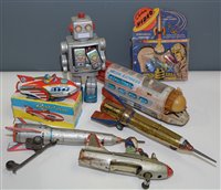 Lot 1094 - Tin plate robot and rockets