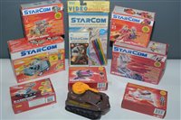 Lot 1435 - Starcom vehicles and book/video