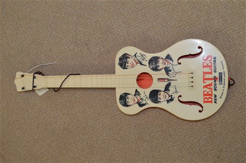 A Selcol "New Beats" Beatles toy guitar with the original box A Selcol "New Beats" Beatles toy guitar with the original box