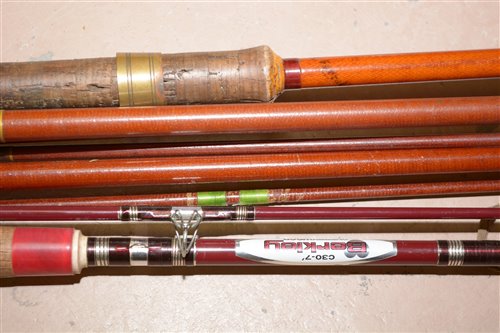 Lot 207 - A collection of three brown fibre glass fishing rods