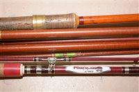 Lot 207 - A collection of three brown fibre glass fishing rods