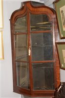 Lot 740 - A Georgian mahogany glazed corner cupboard.