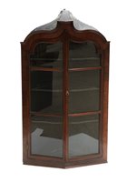 Lot 740 - A Georgian mahogany glazed corner cupboard.