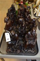 Lot 543 - Ten carved wooden figures.