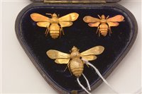 Lot 482 - Three gold bee brooches, boxed