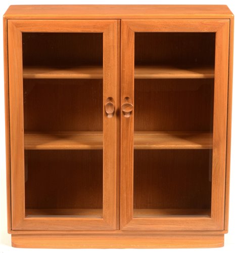 Lot 64 - Ercol small glazed bookcase.