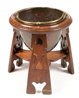 Lot 723 - An Arts & Crafts oak and copper jardiniere.