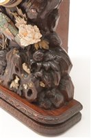 Lot 676 - A rare and unusual Japanese carved mantel clock.
