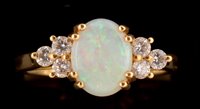 Lot 559 - Opal and diamond ring