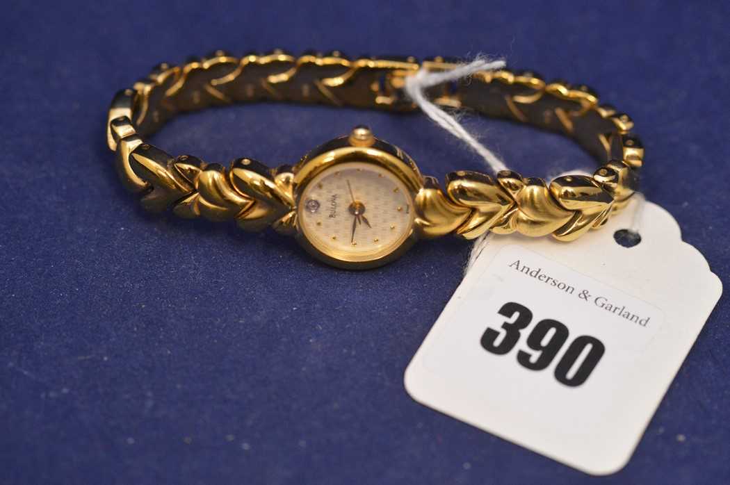 Lot 461 - Bulova : A lady's gold tone and steel quartz wristwatch