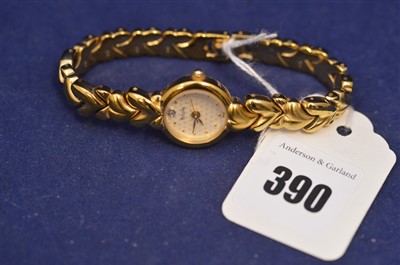 Lot 461 - Bulova : A lady's gold tone and steel quartz wristwatch
