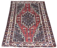 Lot 650 - A Mazlegan rug.