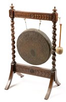 Lot 755 - A late Victorian oak and brass gong.