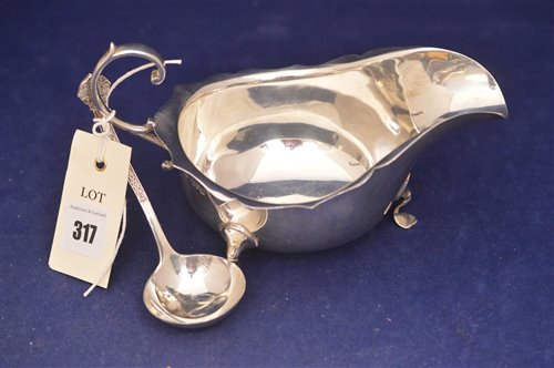 Lot 317 - Silver sauceboat and ladle