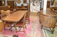 Lot 717 - An 8 piece oak dining room suite