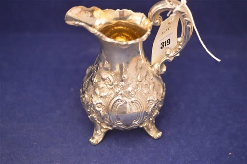 Lot 319 - Victorian embossed silver milk jug