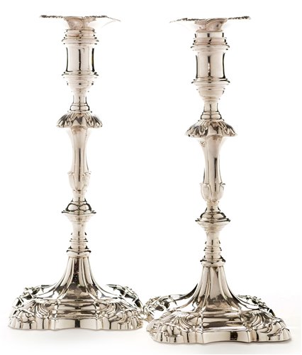423 - A pair of George III candlesticks.