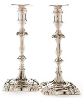 Lot 423 - A pair of George III candlesticks.