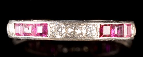 Lot 547 - Ruby and diamond eternity ring