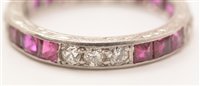 Lot 547 - Ruby and diamond eternity ring