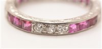 Lot 547 - Ruby and diamond eternity ring