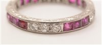 Lot 547 - Ruby and diamond eternity ring