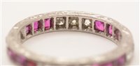 Lot 547 - Ruby and diamond eternity ring