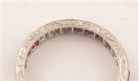 Lot 547 - Ruby and diamond eternity ring