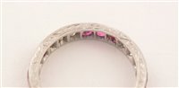 Lot 547 - Ruby and diamond eternity ring