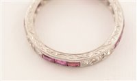Lot 547 - Ruby and diamond eternity ring