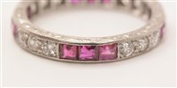 Lot 547 - Ruby and diamond eternity ring